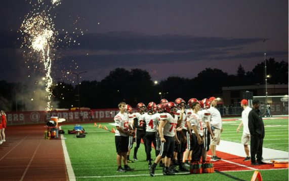 The Whitmore Lake football team getting ready for a play during a football game.