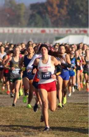 Trojan cross country runner competing in a race