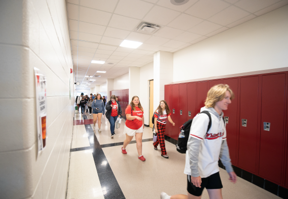 Students walking down a school hallway