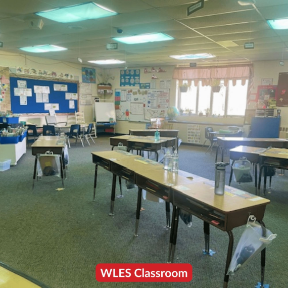 An empty classroom with empty desks at Whitmore Lake Elementary School.